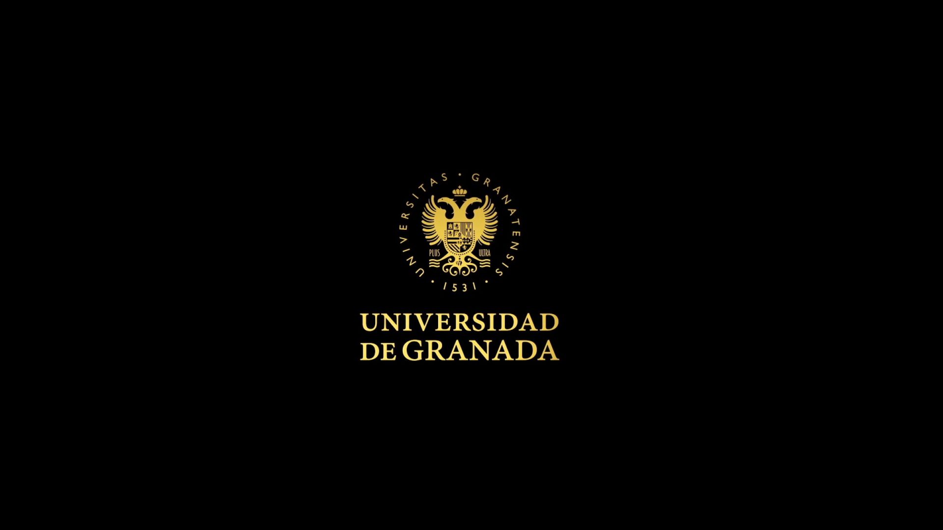 logotipo dorado de la Universidad de Granada sobre fondo negro